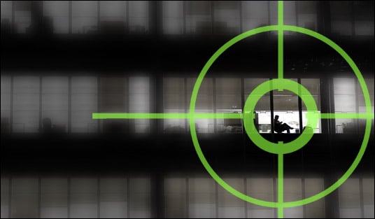 Green target scope over an office building window | Counter Espionage