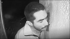 Prowler caught on CCTV licking doorbell.