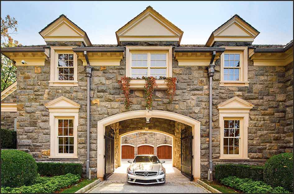 Luxury car parked in front of mansion